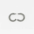 Pair of silver hoop earrings with clear rhinestones on a white background