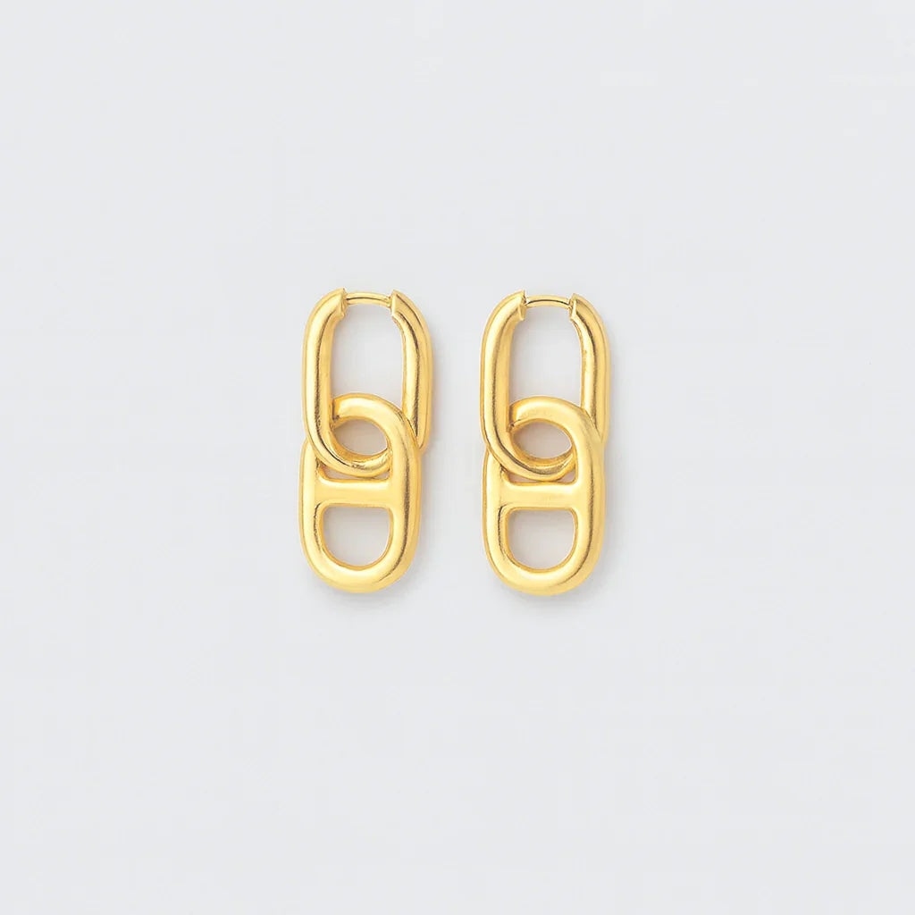 Gold chain link earrings with a modern geometric design on a plain white background