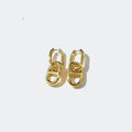 Gold chunky chain link earrings on a white background