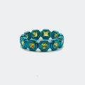 Blue eternity band with square yellow gemstones on white background