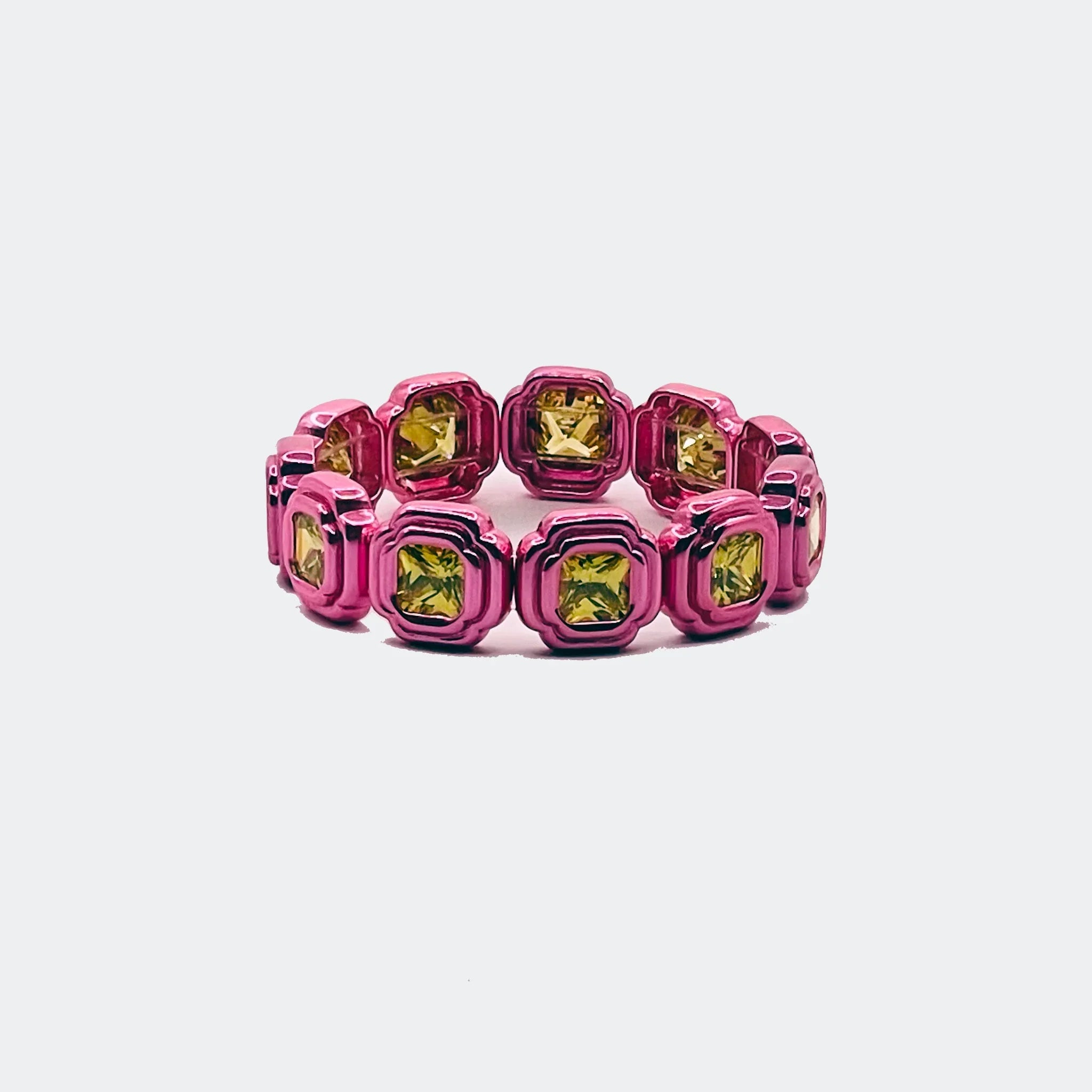Pink square link ring with yellow gemstones, modern jewelry on white background