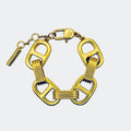 Bold gold link bracelet with geometric rectangular chain design on light background