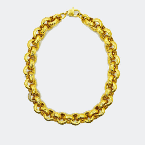 Chunky gold chain necklace with textured links on white background